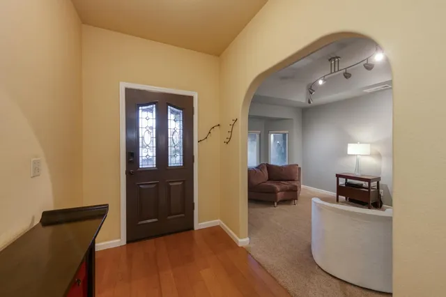 a bedroom with furniture and wooden floor
