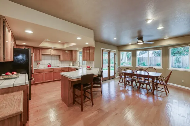 a kitchen with a table and chairs in it
