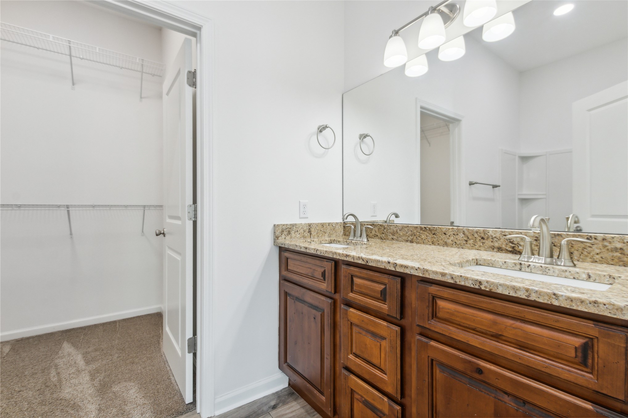 87279 Lents Road Yulee, FL 32097 - Photo 26 of 40 a bathroom with a granite countertop sink and a mirror