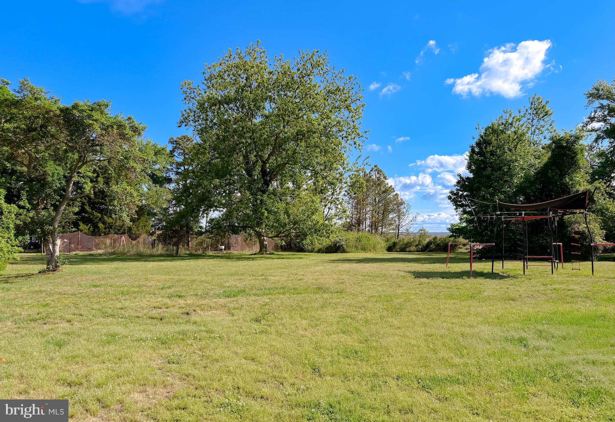 16146 Thomas Road Piney Point, MD 20674 - Photo 53 of 57 a view of a swimming pool with an outdoor space and seating area