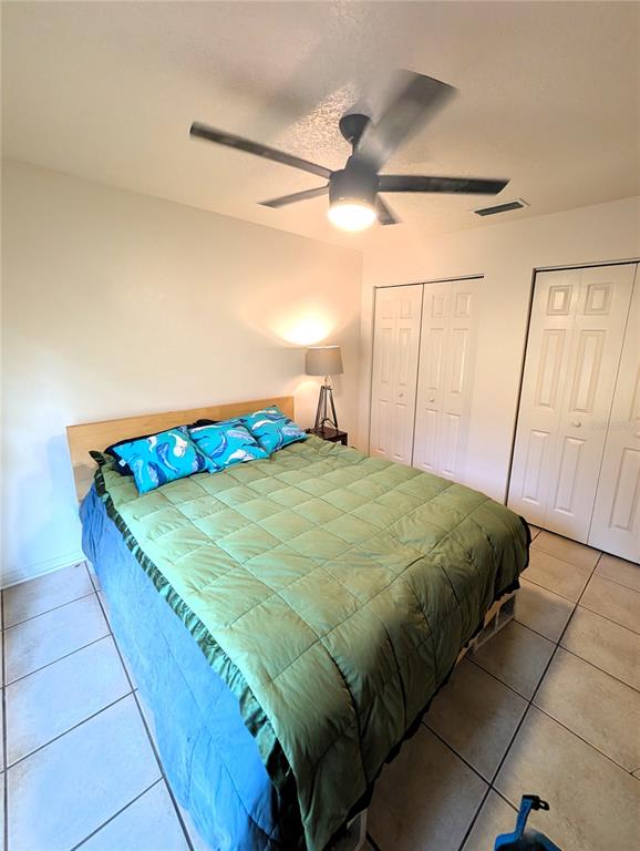 2775 25th Street Sarasota, FL 34234 - Photo 11 of 23 a bedroom with a bed and a mirror