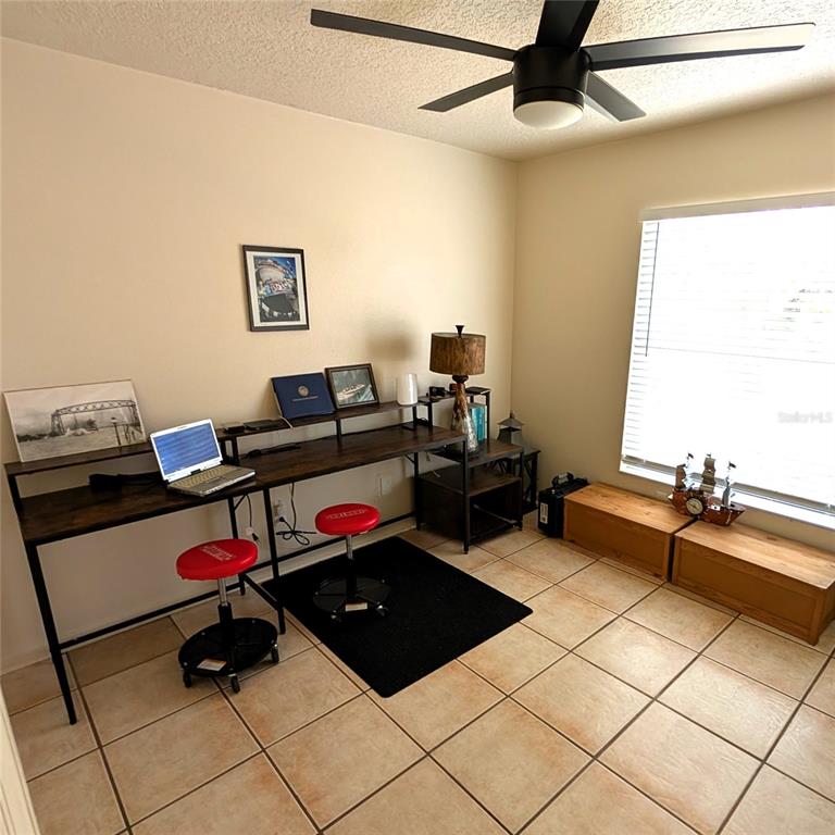 2775 25th Street Sarasota, FL 34234 - Photo 16 of 23 a living room with furniture and a window