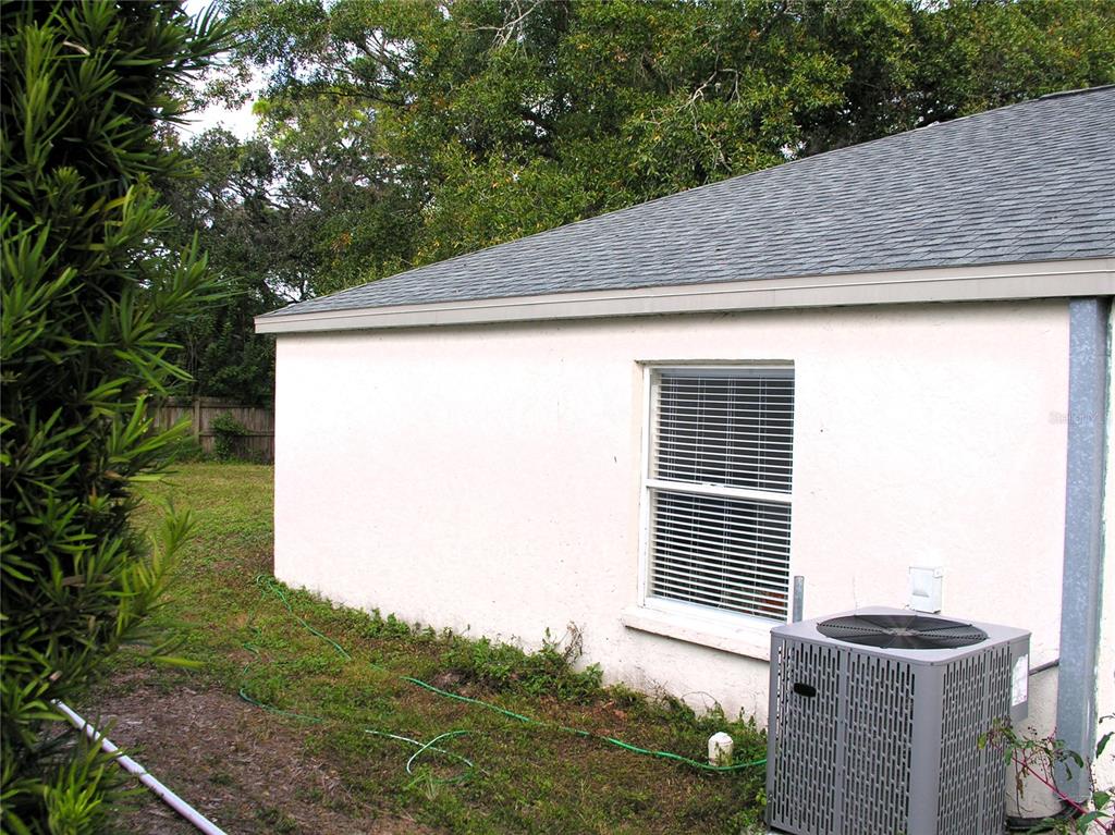 2775 25th Street Sarasota, FL 34234 - Photo 18 of 23 a backyard of a house with lots of green space