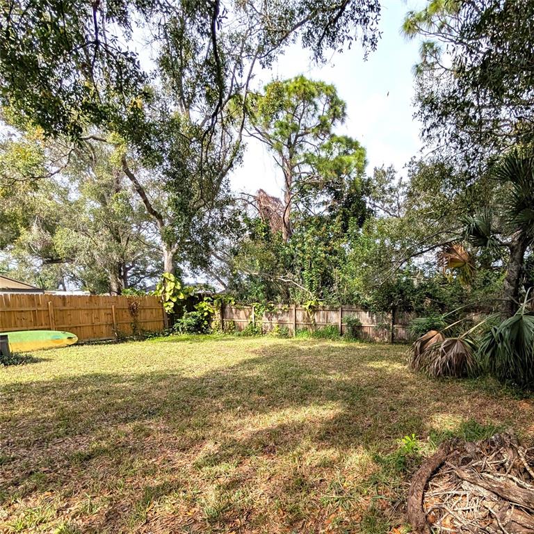 2775 25th Street Sarasota, FL 34234 - Photo 23 of 23 a view of a field with trees in the background