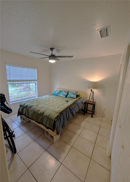 2775 25th Street Sarasota, FL 34234 - Photo 9 of 23 a bedroom with a bed and window