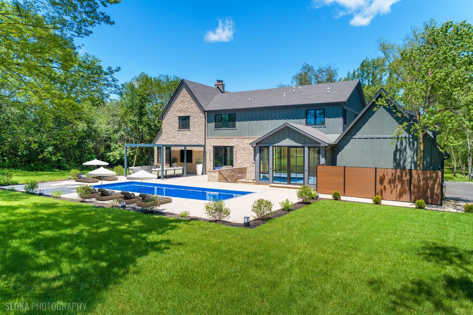 699 Plum Tree Road Barrington Hills, IL 60010 - Photo 5 of 84 a front view of house with backyard and swimming pool