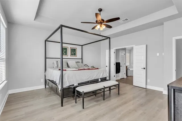 a bed room with a bed and a chandelier