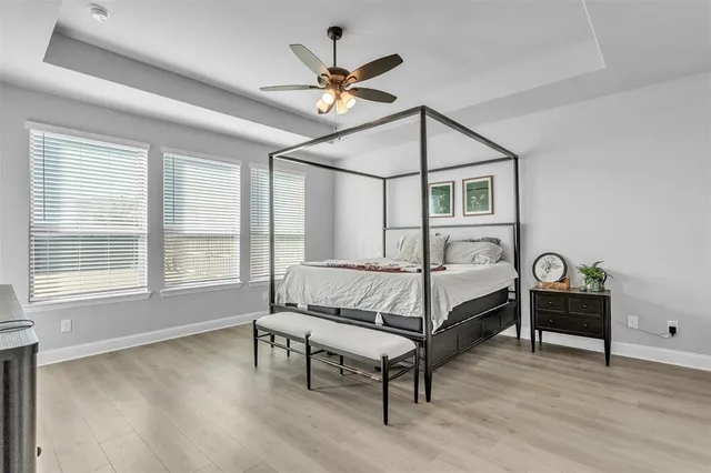 a bed room with a bed and a window