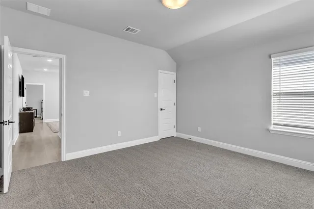 an empty room with windows and a view