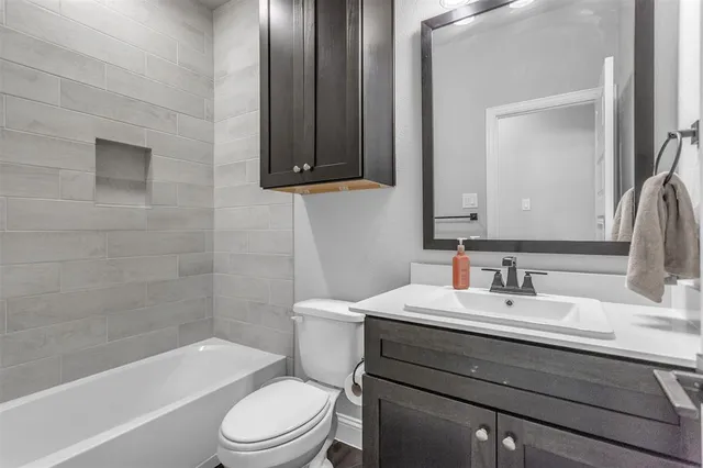 a bathroom with a sink a toilet and a bathtub