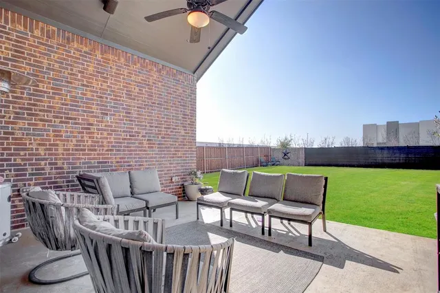 a patio with table and chairs