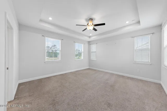 a view of empty room with windows