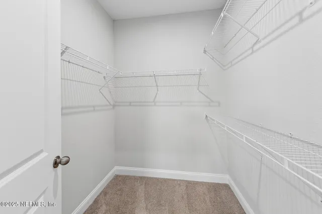 a view of a room with racks on the wall