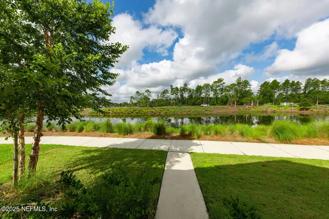 a view of a lake with a big yard