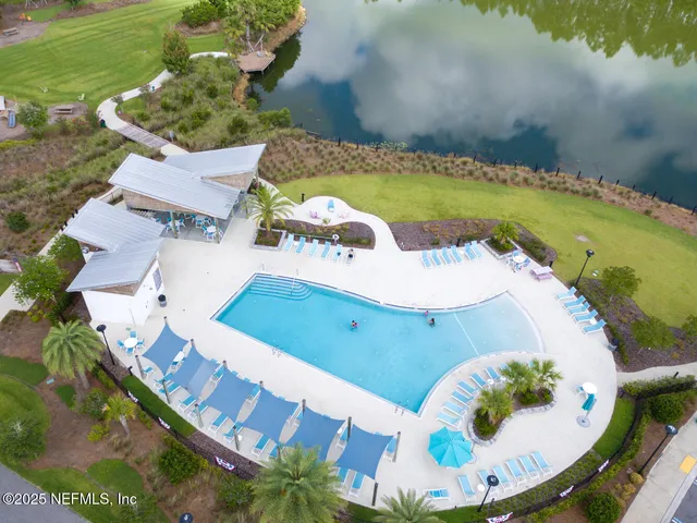 an aerial view of a house a yard and a fireplace
