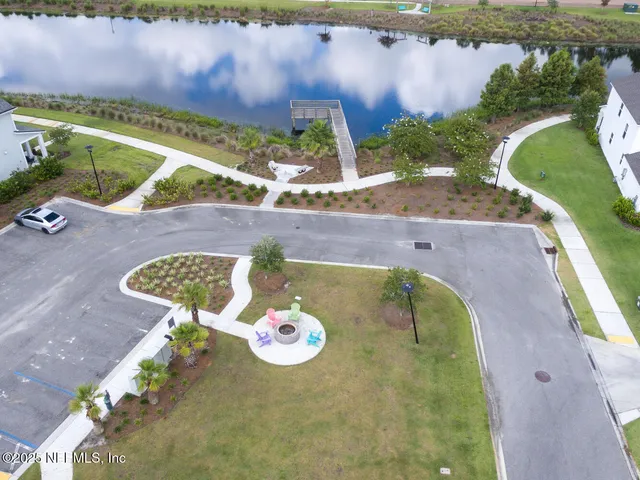 an aerial view of a house with outdoor space