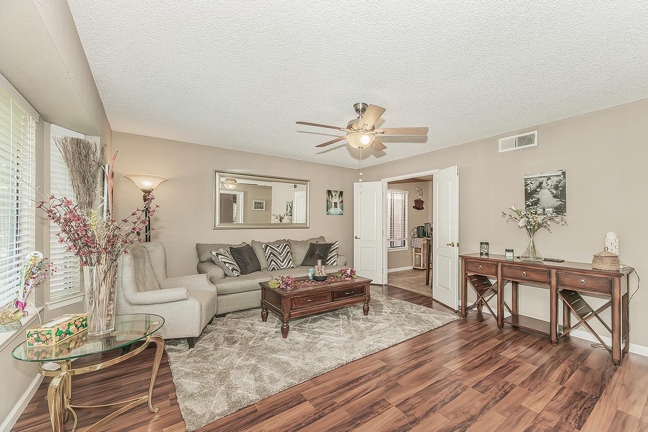1908 East Niles Avenue Fresno, CA 93720 - Photo 3 of 30 a living room with furniture and wooden floor