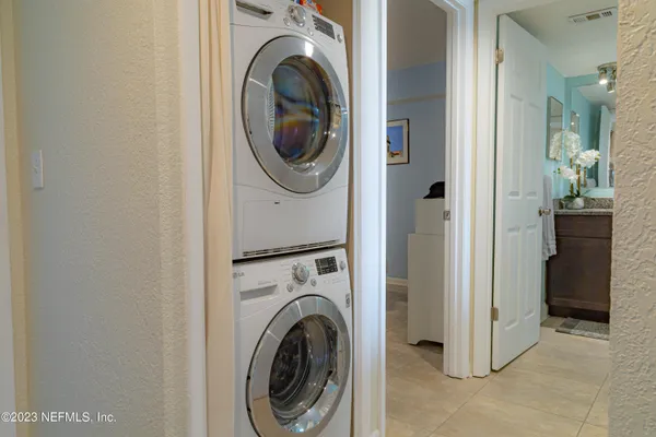 a view of a hallway with washer and dryer
