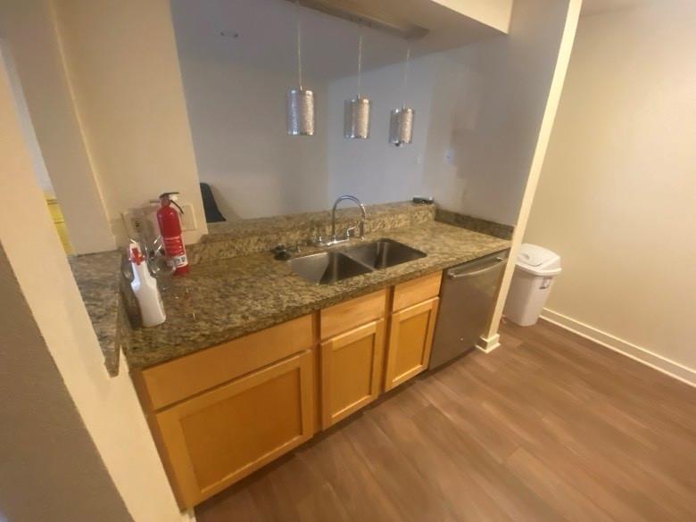 4777 Cedar Springs Road, Unit 5B Dallas, TX 75219 - Photo 8 of 10 a bathroom with a granite countertop sink and a mirror