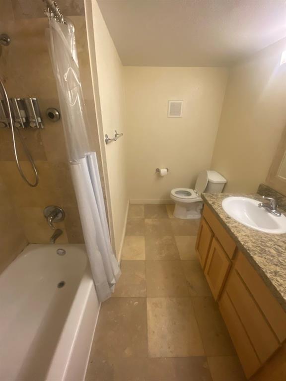 4777 Cedar Springs Road, Unit 5B Dallas, TX 75219 - Photo 9 of 10 a bathroom with a sink a toilet and shower