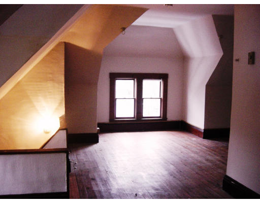 25 Trillium Street Springfield, MA 01108 - Photo 12 of 17 a view of an empty room with wooden floor and a window