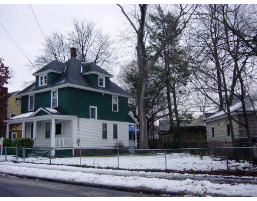 25 Trillium Street Springfield, MA 01108 - Photo 2 of 17 a front view of a house with garden