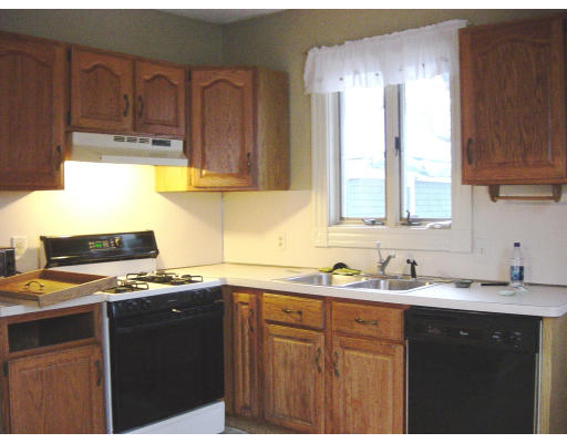 25 Trillium Street Springfield, MA 01108 - Photo 7 of 17 a kitchen with stainless steel appliances granite countertop a sink stove and cabinets