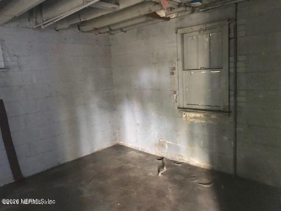 2036 Moncrief Road Jacksonville, FL 32209 - Photo 29 of 32 a view of a room with racks on the wall