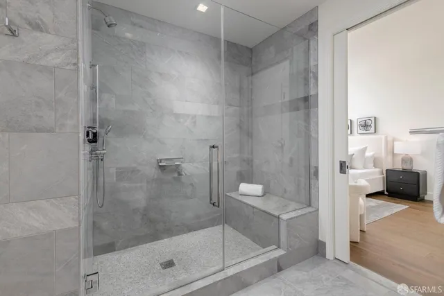 a dining room with furniture a chandelier and window