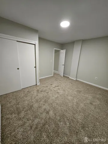 an empty room with closet area
