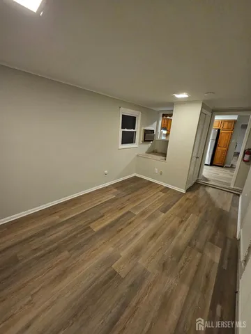 a view of a livingroom with wooden floor