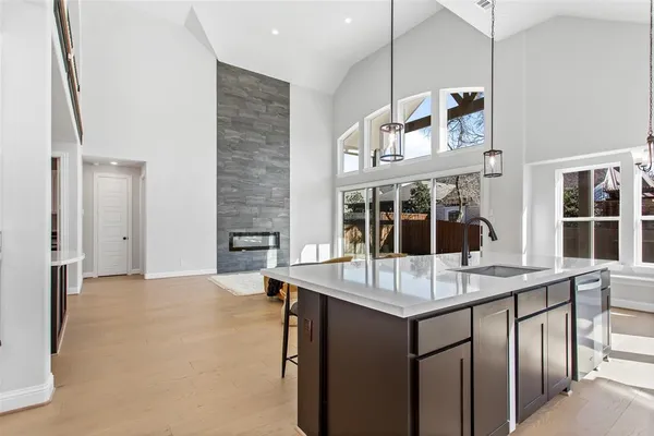 a view of kitchen with granite countertop window