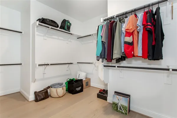 a view of a closet with storage