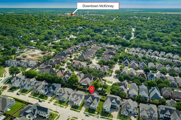 a view of a bunch of trees and cars