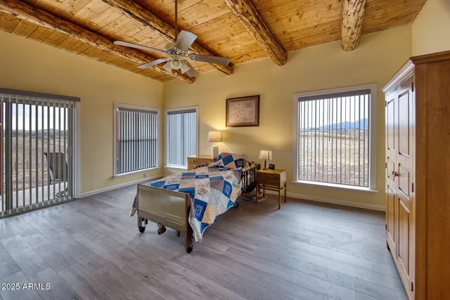 a bedroom with furniture and window