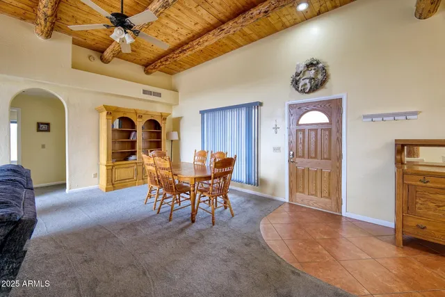 a view of a livingroom with furniture and window
