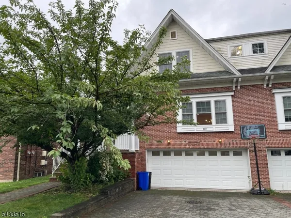 a front view of a house with a garage