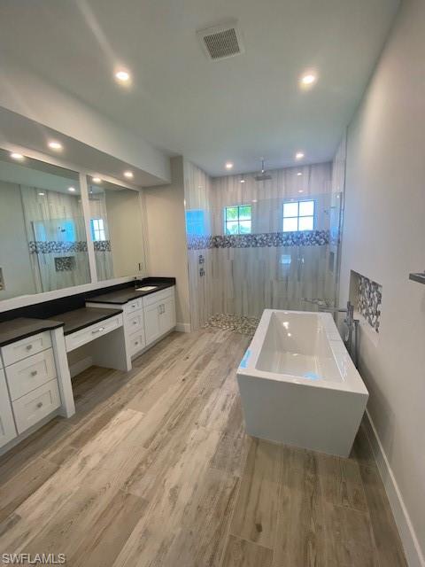 10 Willoughby Drive Naples, FL 34110 - Photo 7 of 11 a large hall with stainless steel appliances granite countertop a sink a stove a microwave a counter and a sink