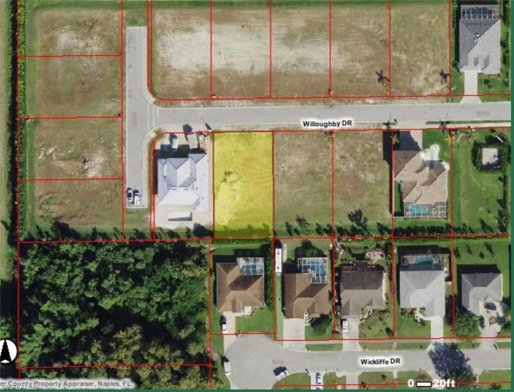 10 Willoughby Drive Naples, FL 34110 - Photo 8 of 11 a picture of a bathroom with a sink and a mirror