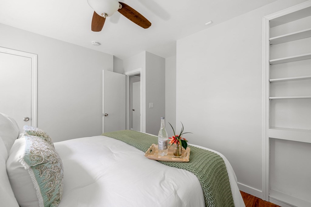 412 Worcester Road Barre, MA 01005 - Photo 22 of 31 a bedroom with a bed and a chandelier