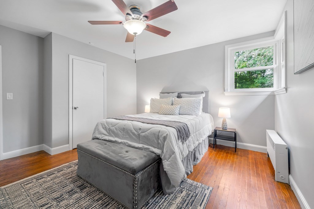 412 Worcester Road Barre, MA 01005 - Photo 24 of 31 a bedroom with a bed and wooden floor