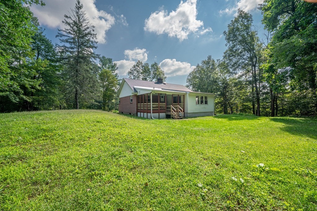 412 Worcester Road Barre, MA 01005 - Photo 26 of 31 a front view of a house with garden