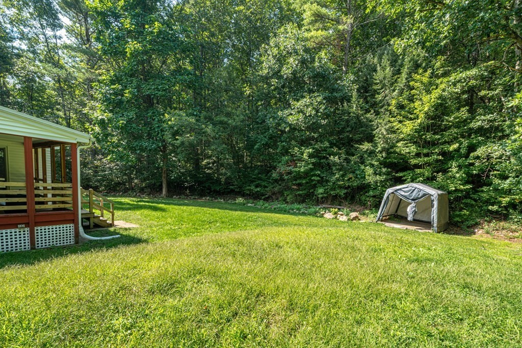 412 Worcester Road Barre, MA 01005 - Photo 27 of 31 a view of a backyard with a small cabin