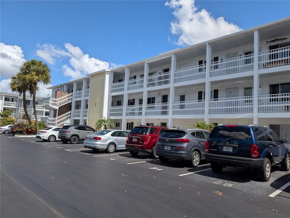 5929 Easy Street, Unit I23 Bradenton, FL 34207 - Photo 1 of 24 a car parked in front of a building