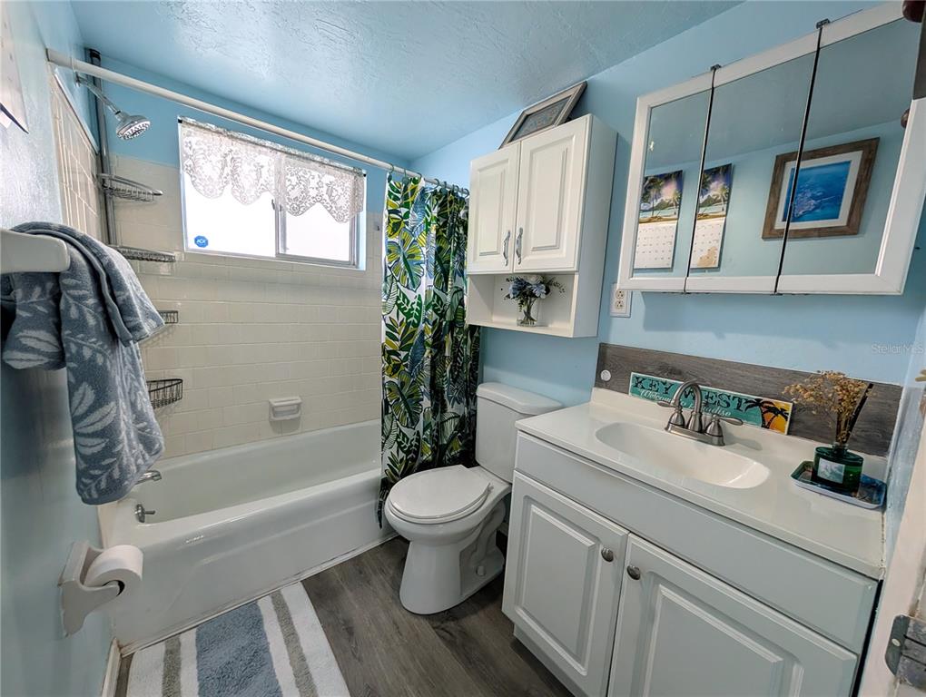5929 Easy Street, Unit I23 Bradenton, FL 34207 - Photo 13 of 24 a bathroom with a sink toilet and shower