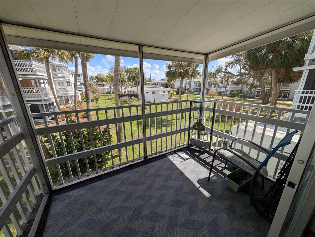 5929 Easy Street, Unit I23 Bradenton, FL 34207 - Photo 16 of 24 a view of a porch with wooden floor