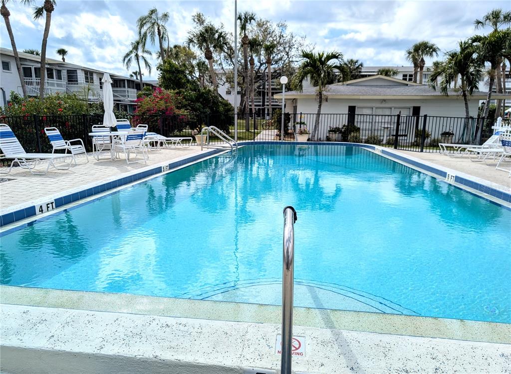 5929 Easy Street, Unit I23 Bradenton, FL 34207 - Photo 17 of 24 a swimming pool view with a outdoor seating