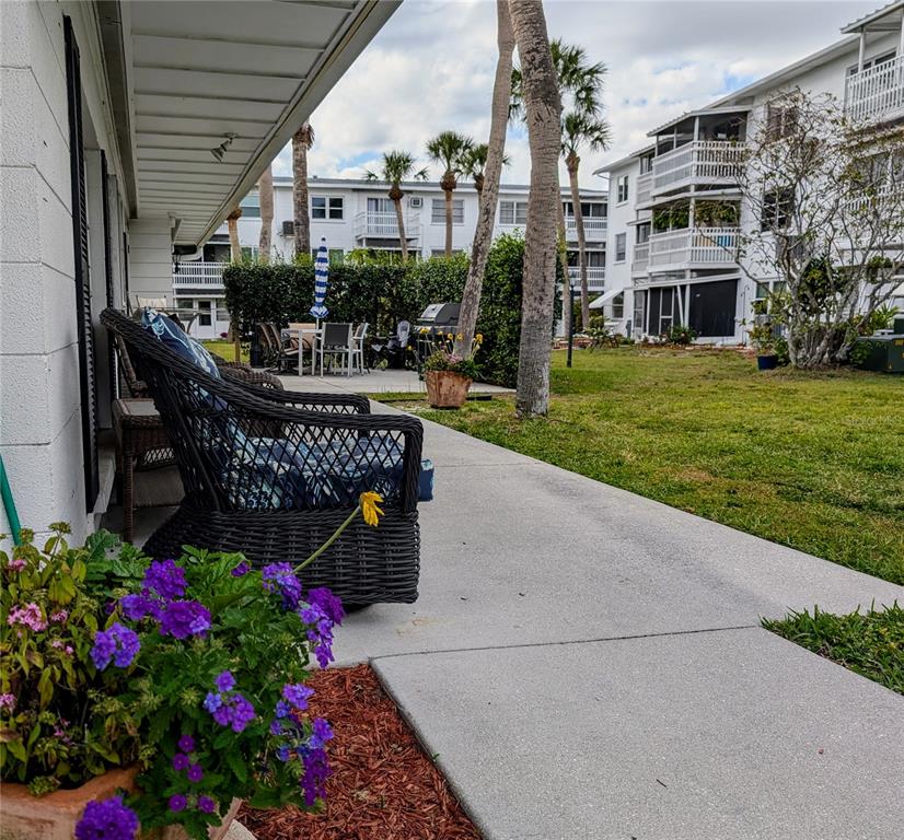 5929 Easy Street, Unit I23 Bradenton, FL 34207 - Photo 20 of 24 a view of a house with backyard and sitting area