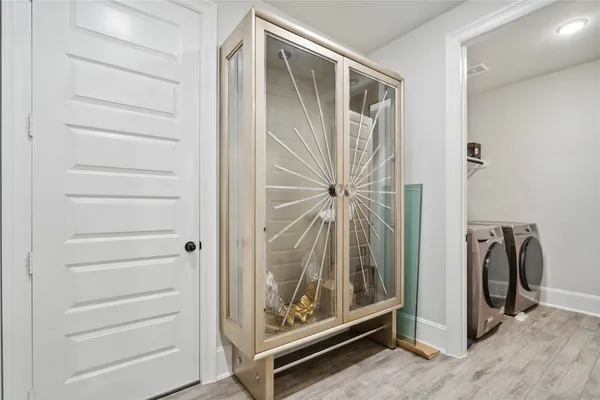 a view of an entryway with wooden floor