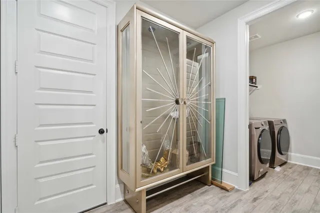 a view of an entryway with wooden floor